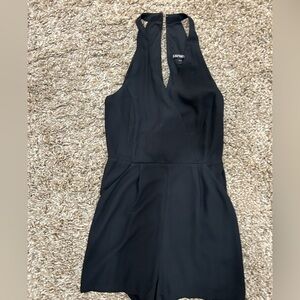 Express fulled lined halter short romper w/ front pockets. 100% polyester.